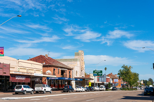 Scone, Australia - April 23, 2014: Australian rural town of Scone amin street with shops and small business stores