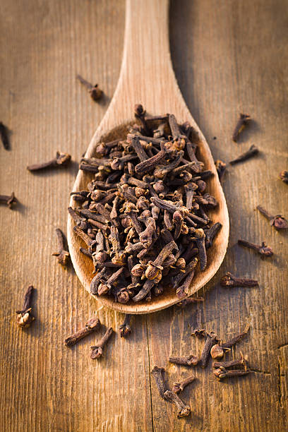 istock cloves in a wooden spoon 120344193