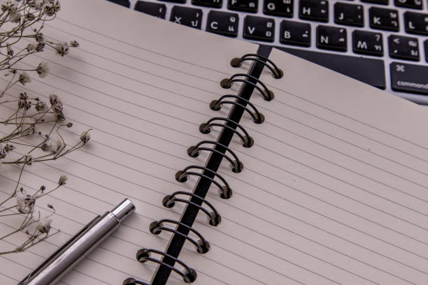istock Open empty blank notebook organizer with pen for planning work on laptop. Concept for business, Planning or diary. Great for any use. 1203443257