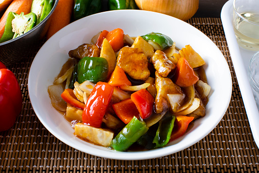 Japanese style home-cooked pork (Subuta). Fry pork and fry peppers, paprika, onions, carrots and bamboo shoots.\nMelt the sweet vinegar with a squeeze and tie it to the ingredients.