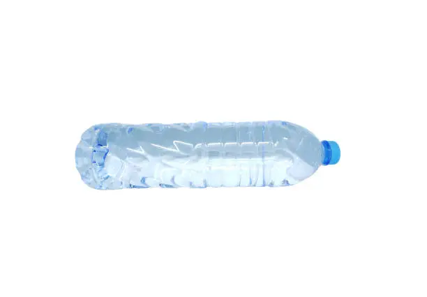 Photo of Single plastic water bottle isolated on a white background