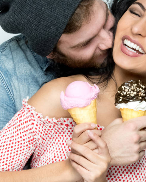 istock Male hipster wearing button down shirt and holding dessert 1203448620