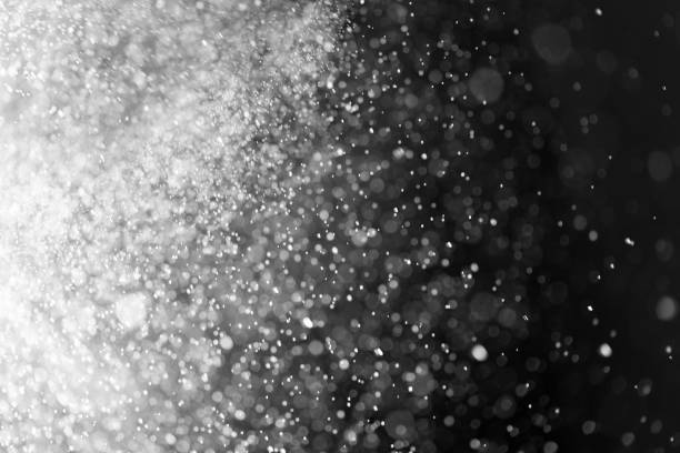 istock Abstract bokeh glitter lights on dark black background. 1203455266