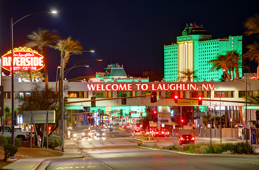 Laughlin, Nevada, USA - March 16, 2019: Evening view of the Laughlin welcome sign on Casino Drive in Clark County, Nevada