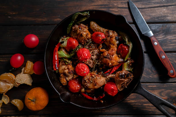 Roast chicken thigh, with tomato,garlic and chilli pepper