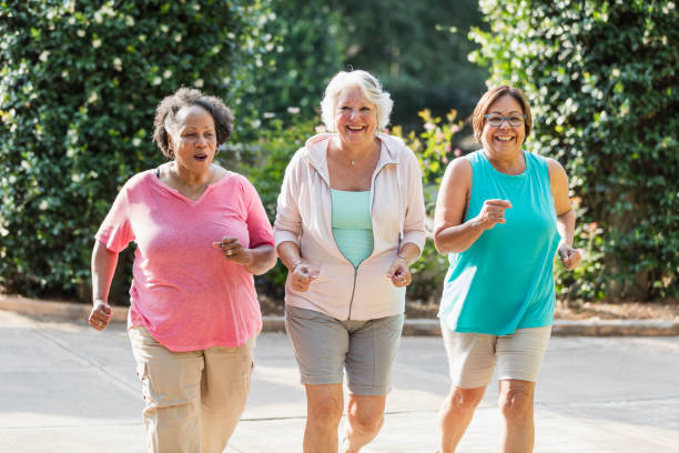 istock Multi-ethnic senior women exercising together 1203478343