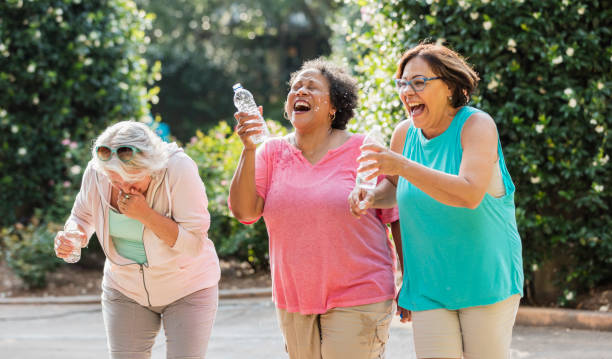 istock Multi-ethnic senior women at a park laughing 1203478454