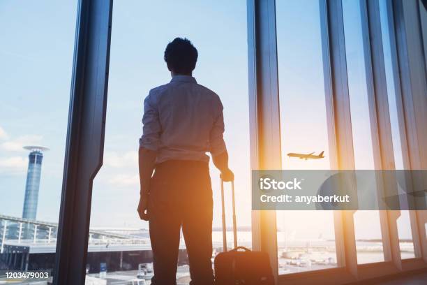 Business Travel Man In Airport Stock Photo - Download Image Now - Airport, Global Business, Travel