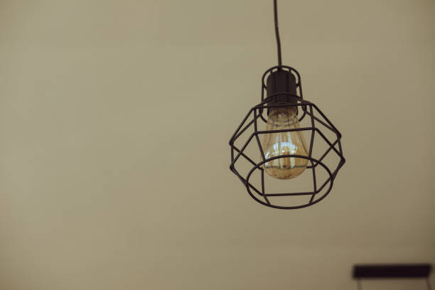 istock Edison's light bulb and lamp in modern style. Warm tone light bulb lamp 1203480169