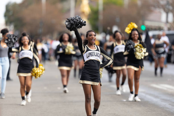 Bayou Classic Parade New Orleans, Louisiana, USA - November 30, 2019: Bayou Classic Parade, Members of the Lumberjacks cheerleaders performing at the parade cheerleader photos stock pictures, royalty-free photos & images