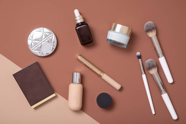 Professional make-up artist flat lay on beige background for fashion woman. Professional make-up artist flat lay on beige background for fashion woman. make up brush photos stock pictures, royalty-free photos & images