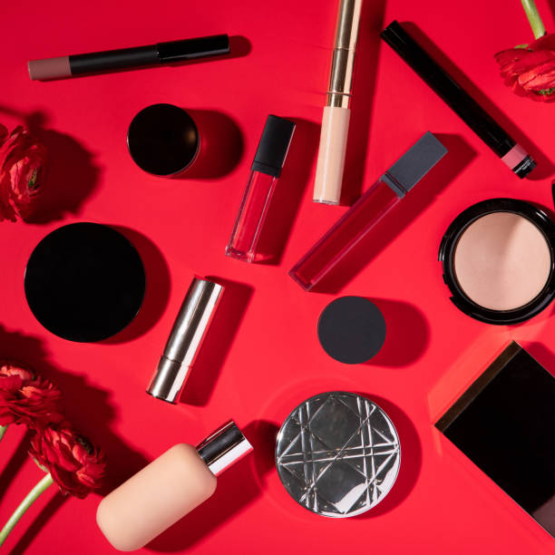 Cosmetics in beautiful style on red background. Top view, flat lay