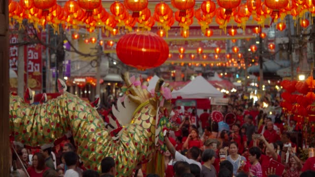 4k slowmotion.Chinese lanterns and dragon dance on Chinese new year.