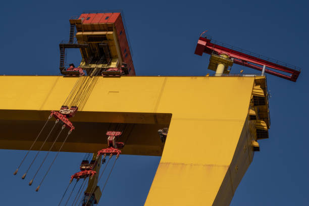 istock Partial view of a yellow gantry crane at a shipyard 1203489050
