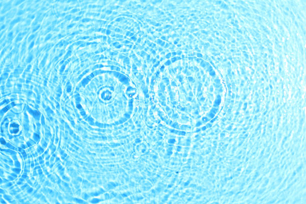 istock texture of splashing clean water on blue background 1203490100