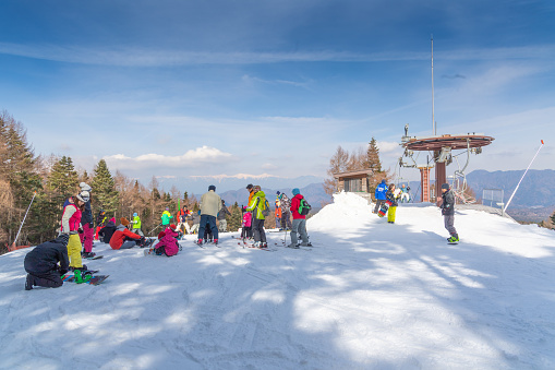 Yamanashi, Japan March 12,2017: Mount Fuji view, Crowd tourists enjoy of ski resort, slope snow valley pine, Fujiyama Top beautiful in Japan beautiful landscape in winter time at Fujiten ski resort