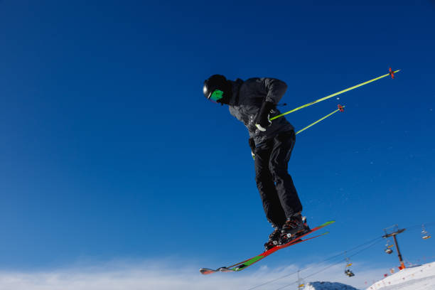 istock Skier jumps in the snowy mountains 1203491962