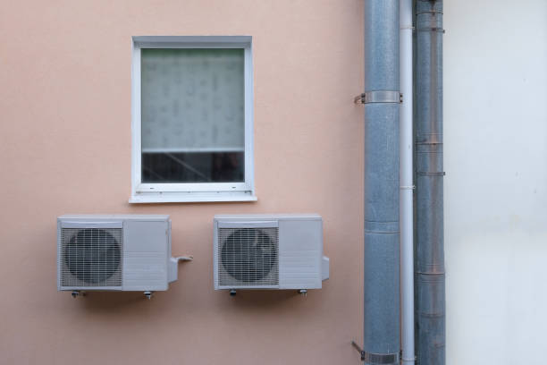 istock Window with air conditioning and drainpipes. Close-up. 1203493815