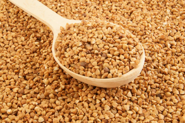 istock Buckwheat with wooden spoon 1203496082