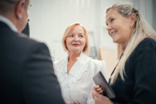 istock close up. group of employees standing in the office 1203497169