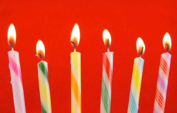 istock Colorful birthday candles on blue background 1203498938