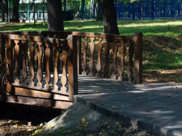 istock wooden bridge over a ditch in the summer Park 1203498981