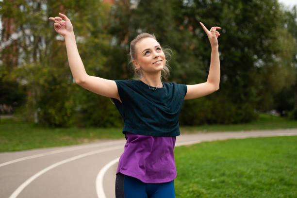 istock Athletic girl, on a treadmill, having fun and smiling. 1203502050