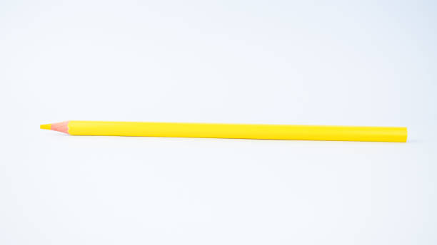istock Single yellow colored pencil crayon on a white isolated background, 1203502433