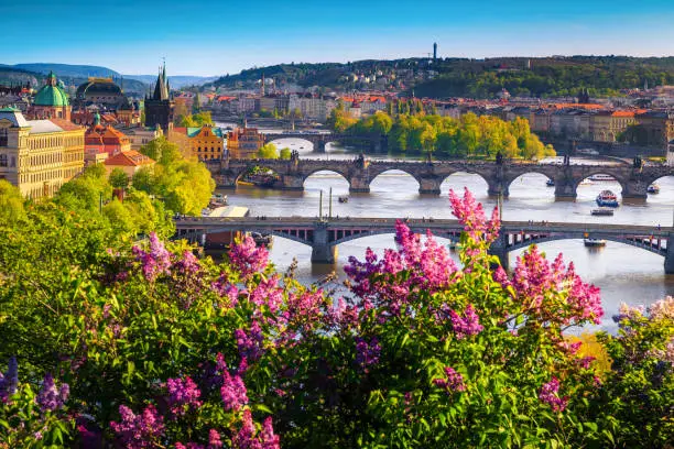 Photo of Wonderful spring panorama of Prague with river and bridges