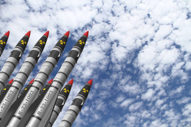istock Atomic rockets earth - air directed upwards against a bright sky with white clouds. Atomic warfare concept. 1203504200