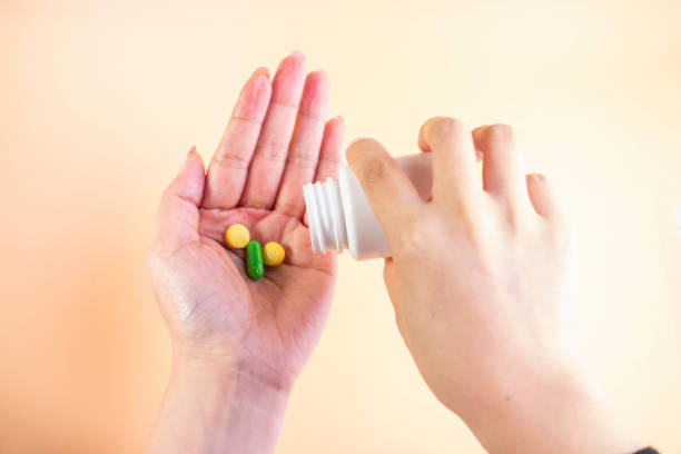 istock Holding the medicine bottle 1203507212
