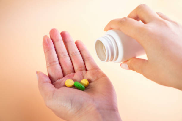 istock Holding the medicine bottle 1203507242