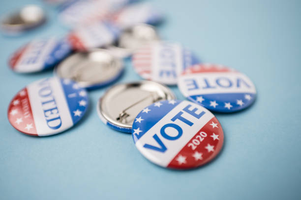 istock Vote election badge button for 2020 background, vote USA 2020 1203510433