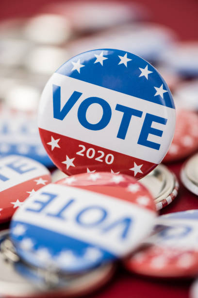 istock Vote election badge button for 2020 background, vote USA 2020 1203510455