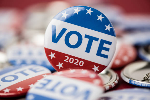 istock Vote election badge button for 2020 background, vote USA 2020 1203510457