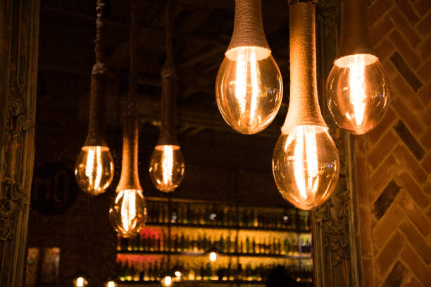 istock Decorative antique style light bulbs on the background of a mirror that reflects the light bulbs. 1203511057