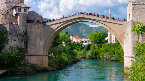 istock People Mostar Bridge (Stari Most). Old Mostar Bridge full of tourists. 1203515214