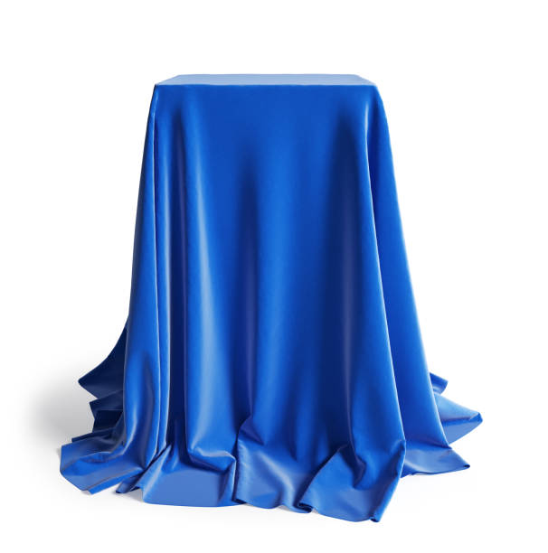 podio vacío cubierto con tela de seda azul. aislado sobre un fondo blanco con trazado de recorte. - cubrir fotografías e imágenes de stock