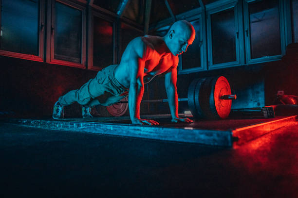 istock Bodybuilder doing push-ups at the gym 1203518845