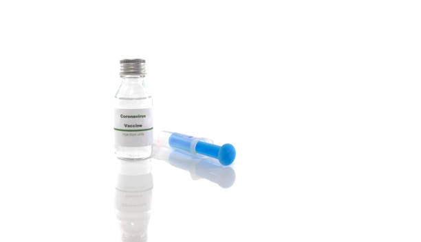 istock Coronavirus vaccine vial with injection syringe 1203522647