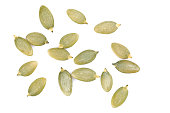 Heap of peeled pumpkin seeds  on a white isolated background