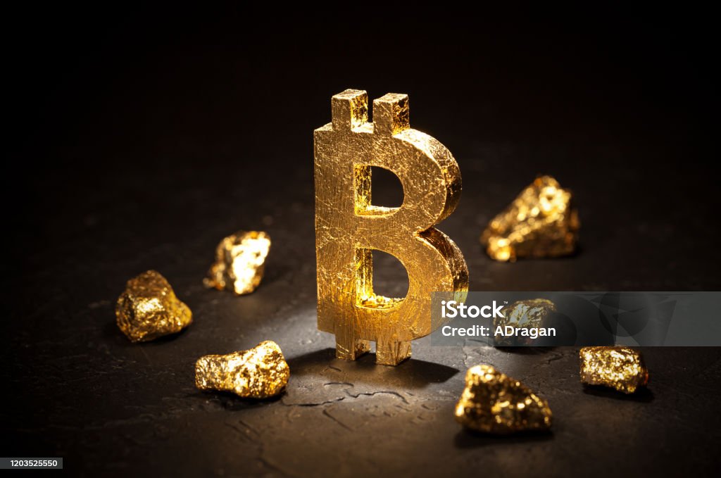 Gold sign bitcoin and gold nuggets on black background Gold sign bitcoin and gold nuggets on black background. Bitcoin Stock Photo