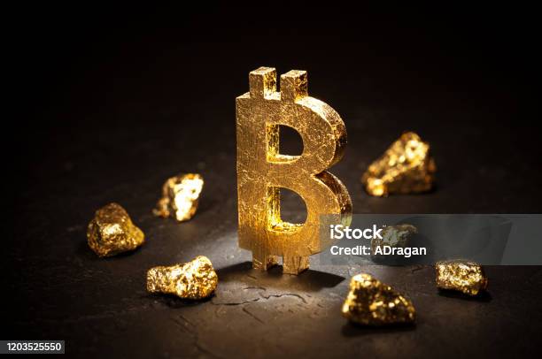 Gold Sign Bitcoin And Gold Nuggets On Black Background Stock Photo - Download Image Now