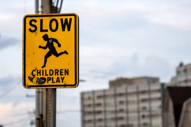 istock slow children caution sign on a street 1203526778
