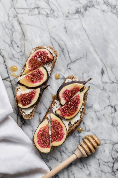 istock sandwich with soft cheese, figs and honey 1203528925