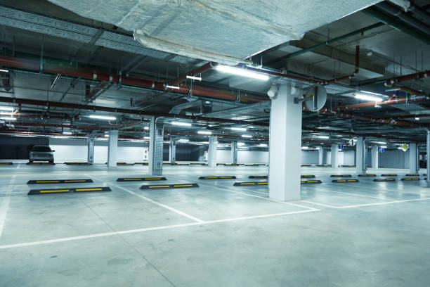 istock Horizontal image of empty underground parking lot 1203532763