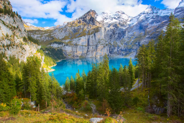 Panorama of Oeschinensee lake and Alps, Switzerland. Oeschinensee lake and Swiss Alps, Switzerland autumn panorama aerial view lake oeschinensee stock pictures, royalty-free photos & images