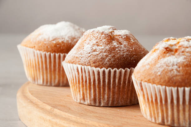 istock Tasty muffin closeup on a wooden board, selective focus. 1203534140