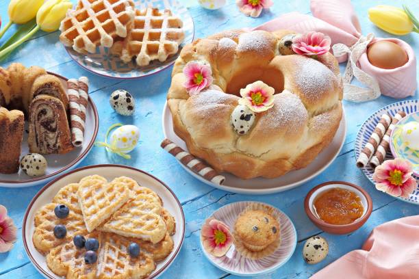 istock Easter festive dessert table with various of cakes, waffles and sweets. 1203535170