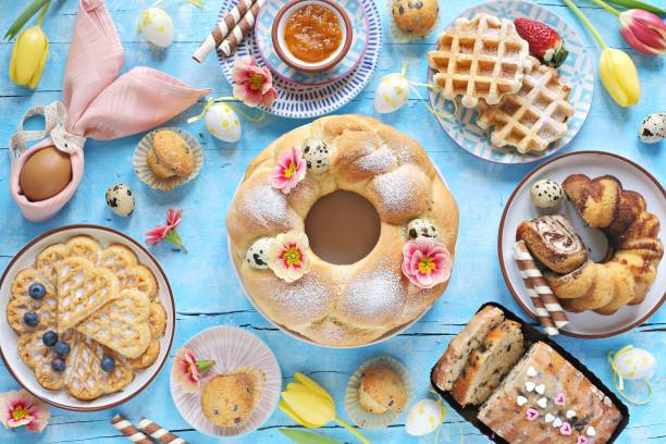 istock Easter festive dessert table with various of cakes, waffles and sweets. 1203535260